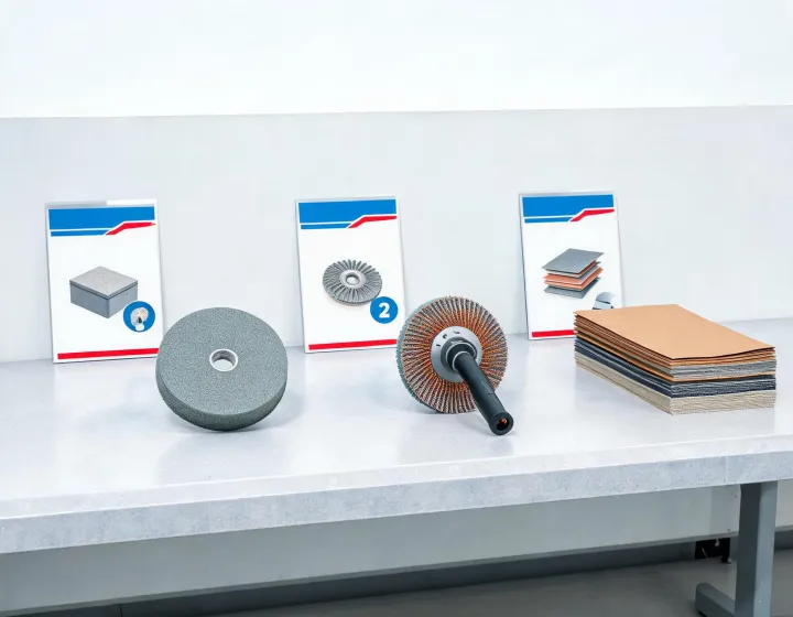 Step-by-step abrasive selection guide on a workbench